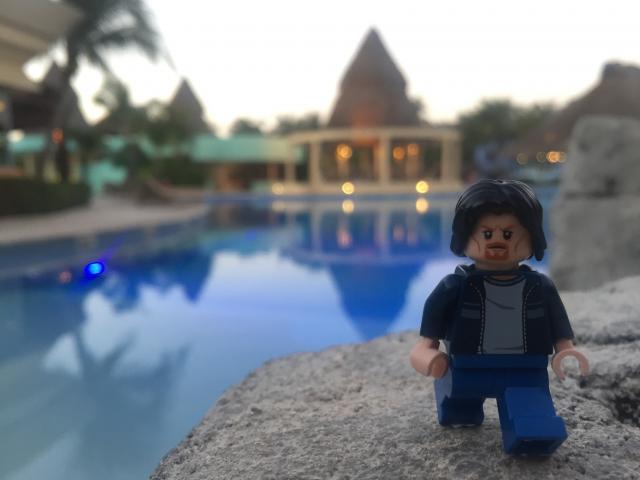 Lego Uncle Jim by the pool at dusk